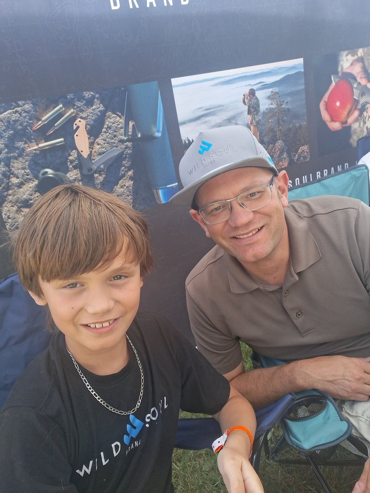 Wild Soul Brand founder and his son smiling at the Wild Soul booth