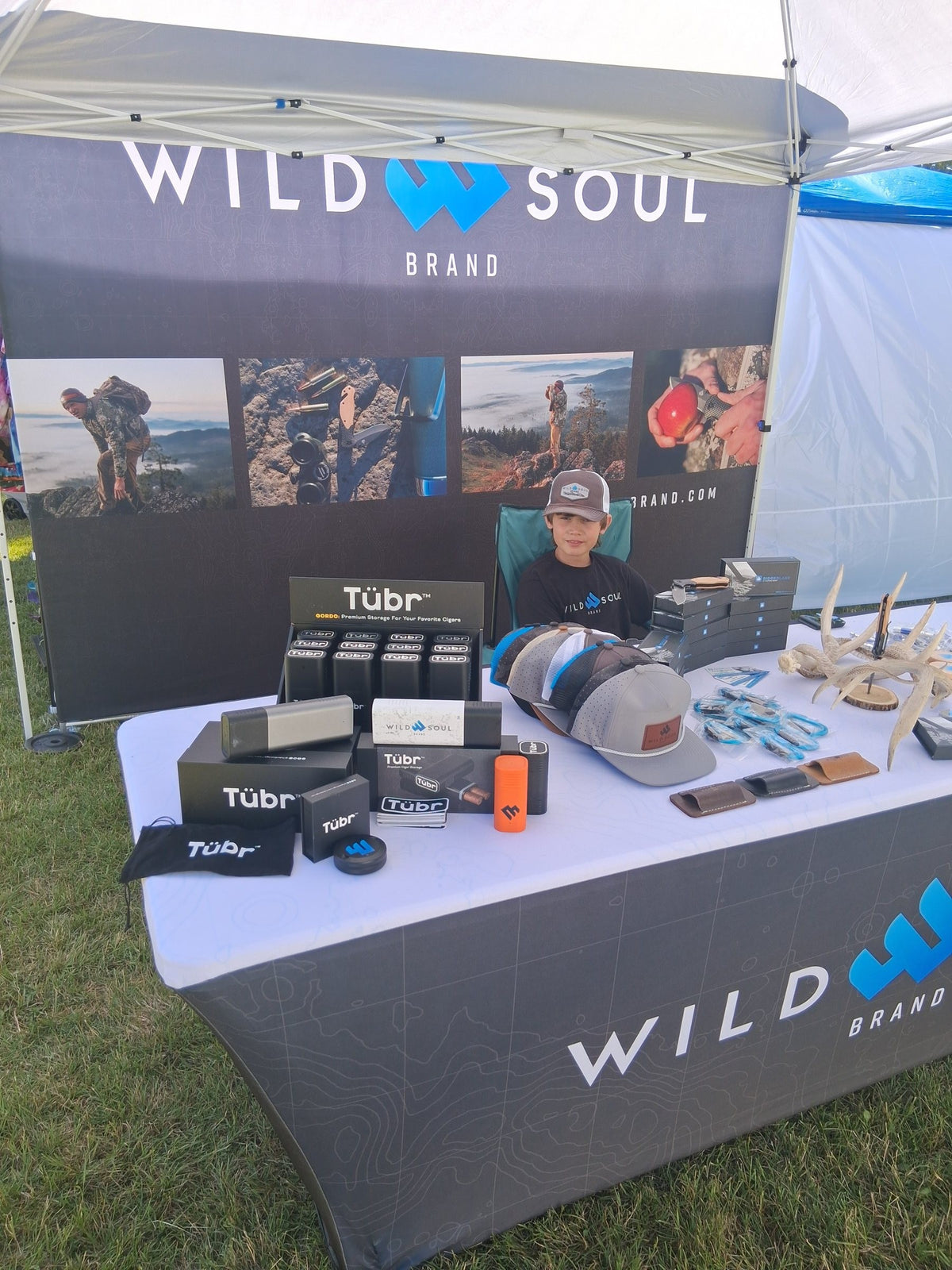 Wild Soul Brand outdoor booth tent with Ridgeblade knives and gear on display