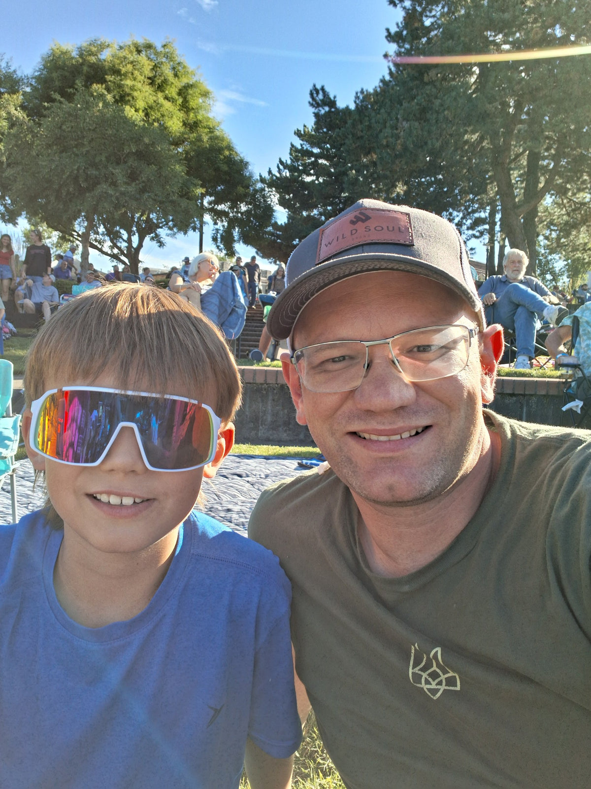 Founder and his son taking a selfie at a summer outdoor event