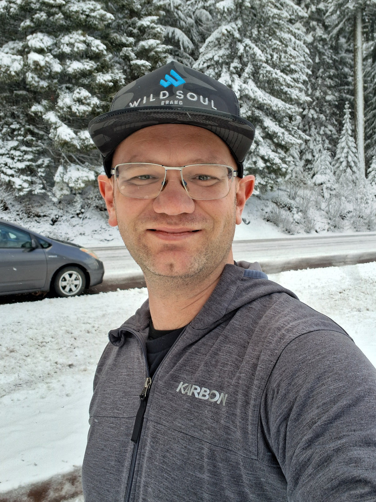 Founder in a Wild Soul Brand hat on a snowy forest road